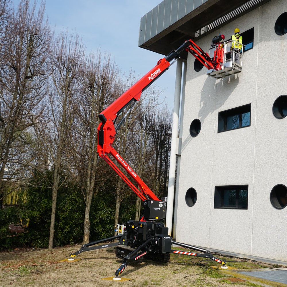 Spider lift working a glazed facade